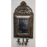 A 19th century pressed brass cushion frame wall mirror with bevelled rectangular primary plate. 69 x