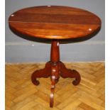 A late 19th century mahogany tripod table, the circular top on turned column three downswept legs