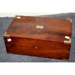 A Victorian mahogany and brass bound writing slope with single well and scriber fitted interior.