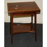 An Edwardian satinwood banded mahogany rectangular, fold over tea table with squareed tapering