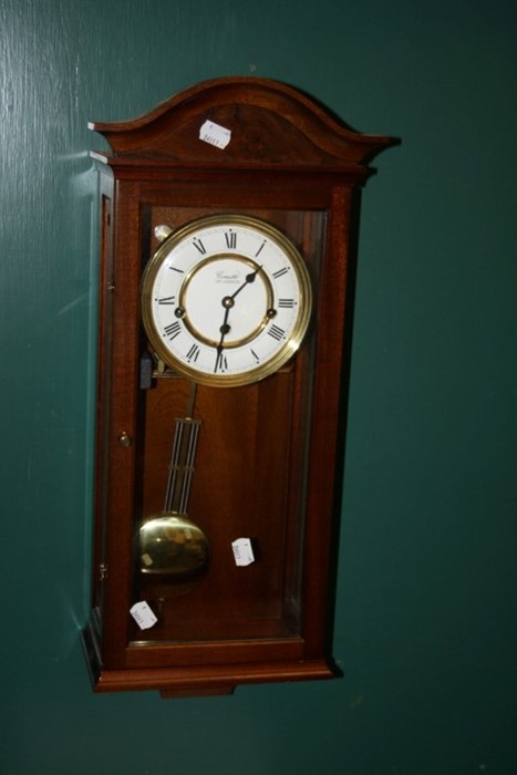 A 20th Century Comitti wall clock, the mahogany case enclosing an eight day Westminster Chime