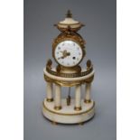 Planchon of Paris (Palais- Royal). A white marble and urmolu mounted demi lune portico clock with e