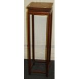 A 20th century Chinese rosewood bronze/urn stand with square top on moulded supports, united by