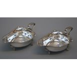 Edward Barnard and sons Ltd., a pair of Geo.V silver sauce boats each of shallow trefoli form with
