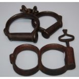 A pair of Victorian  Froggatt type figure of eight  hand cuffs and key and a pair of Froggat /Hiatt