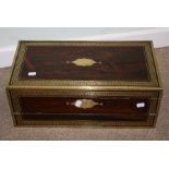A 19th century rosewood, brass bound writing slope, the hinged top and front with Greek key