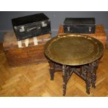 An Indo-Moorish circular, brass topped folding centre table  carved and pierced detail. Raised on