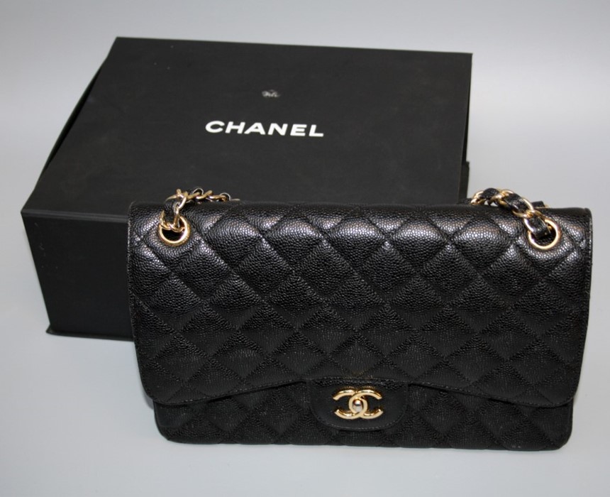 A Chanel-style Jumbo double flap bag with 'gold hardware', boxed.