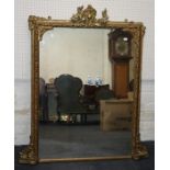 A 19th century giltwood and gesso overmantle mirror, the shield and acanthus surmount above egg