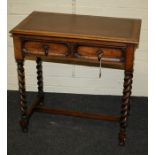 An early 20th century oak writing table, the rectangular scriber set top over a geometrically