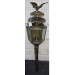 An early 20th century French brass wall lantern, with eagle surmount over two swagged circular