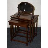 A Geo III style nest of three mahogany inter-sliding occasional tables with slender turned supports,