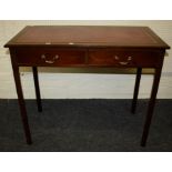 A Geo III style mahogany writing table with tooled leather inset top over two short frieze