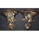 A pair of 20th century cast iron wall pockets of demi-campagna form. 43 x 37 cms.