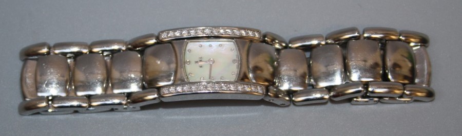 A ladies Ebel Beluga diamond set stainless steel wristwatch, the rounded rectangular dial with