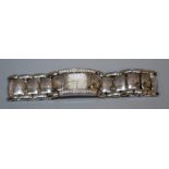 A ladies Ebel Beluga diamond set stainless steel wristwatch, the rounded rectangular dial with