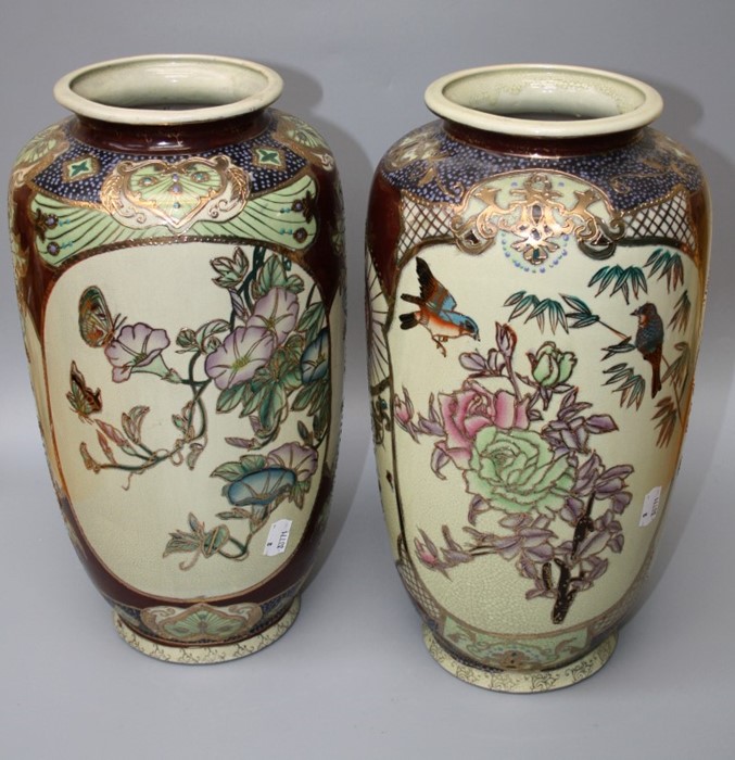 A pair of modern Chinese satsuma-style vases, each decorated with reserves of blossoming trees,