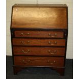 An Edwardian mahogany lady's writing bureau, the fan inlaid fall enclosing scriber and fitted