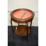 A 19th century walnut, gilt metal mounted bijouterie cabinet, the circular hinged top with brass