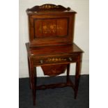 An Edwardian marquetry inlaid rosewood bonheur du jour . The upper section with fall front leather