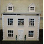A late 20th century doll's house, fashioned as a three storey Georgian town house, containing a good