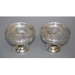 Asprey and Co. Ltd., a pair of Geo.V silver pedestal bon bon dishes, each with pierced bowl, conical