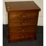 An early 20th mahogany four drawer pedestal chest drawers with swan neck handles. Raised on a plinth