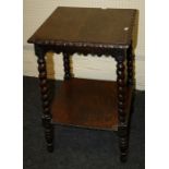 A late Victorian carved oak occasional table with barley twist supports and under-tier. 45cm square