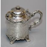John Evans II, a silver cylindrical mustard with domed hinged cover, leaf capped scroll handle and