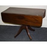 A Geo IV mahogany, pillar Pembroke table with  single frieze drawer. Raised on four reeded sabre