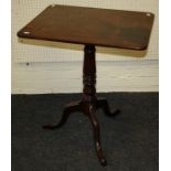 A Geo.III mahogany tripod table, the rectangular snap top on a baluster ring turned column, three