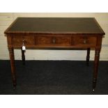 A Victorian mahogany library table, the rectangular top set with hide scriber over three frieze