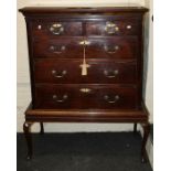 A 19th century mahogany chest, the rectangular top with moulded edge over two short and three long