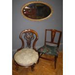 A Victorian carved and pierced, arch back nursing chair with stuff over seat . Raised on squatt