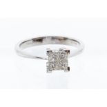 A diamond and 18ct white gold cluster ring, square mount  invisible set with four princess cut