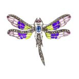 A silver and plique a jour brooch in the form of an dragon fly, the body set with an oval cabochon