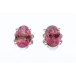 A pair of deep pink tourmaline and silver stud earrings, claw set, size approx 7 x 5mm, post and