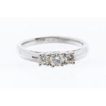 A three stone diamond and 18ct white gold ring, comprising three claw set graduated brilliant cut