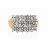 A diamond and 9ct gold seven row cluster ring, set with alternate round brilliant cut and baguette