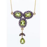 A silver and 9ct gold necklace set with peridots and amethysts, comprising a qua-trefoil cluster