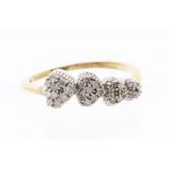 A diamond and 9ct gold ring, comprising three graduated hearts each pave set with diamonds, total