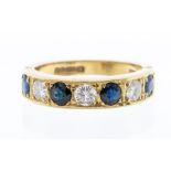 A sapphire and diamond 18ct gold ring, comprising a row of alternate round cut sapphires and