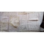 An unusual tiny square handkerchief could be a child's, in white, lawn roundel centre, with a