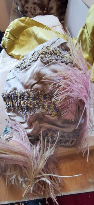 A eau de nil coloured turban style hat in a ribbed silk fabric edged in woven braiding. The front of - Image 2 of 3