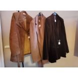 A 1970s ladies brown leather and sheep's wool lined coat, a size 14 wool tweed type ladies suit,