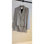 Ladies Calvin Klein 2 piece suit linen and rayon mix. The classic fitted jacket has a stitched