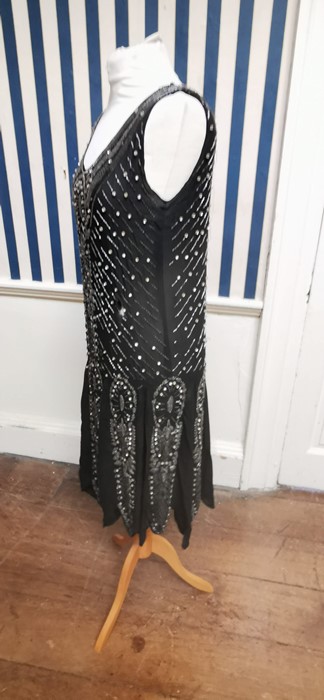 A black beaded Art Deco 1920s dress, this iconic dress is embellished in silver and black bugle - Image 4 of 14