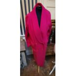 A raspberry pink Christian Dior full length coat with cowl collar with 4 bottoms and flat pockets,