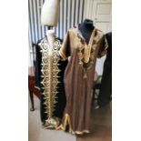 From the wardrobe of Opera singer Jessye Norman. striped gold and deep blue kaftan with a braided