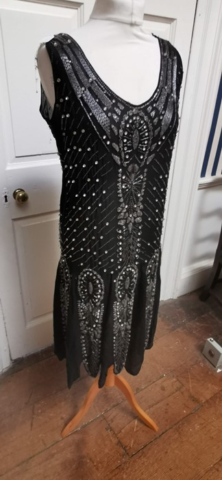 A black beaded Art Deco 1920s dress, this iconic dress is embellished in silver and black bugle - Image 5 of 14